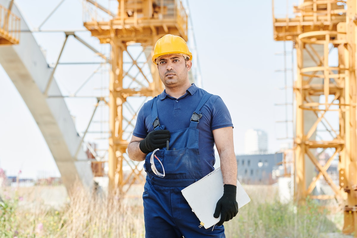 a man wearing safety gears in a construction site