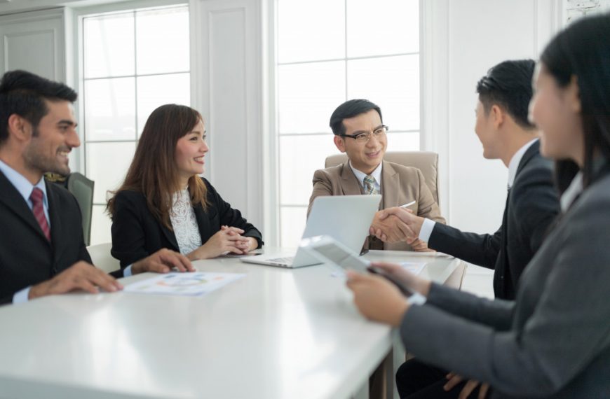 a group of business partners congratulating each other